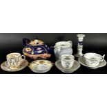 A small collection of 19th century English porcelain tea cups and saucers, hexagonal teapot with