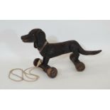 Vintage wooden pull along Dachshund dog toy with moving ears and articulated centre