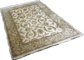 A Zeigler design carpet with an all over floral and frond pattern on a cream ground, 250cm x 170cm