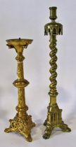 Two good 19th century ecclesiastical candlesticks: A heavy cast brass candlestick with arched