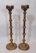 A tall and impressive pair of 19th century ecclesiastical polished brass floor standing picket