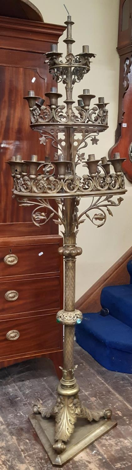 A fine 19th century ecclesiastical gothic brass twenty-four light floor-standing candelabra, with