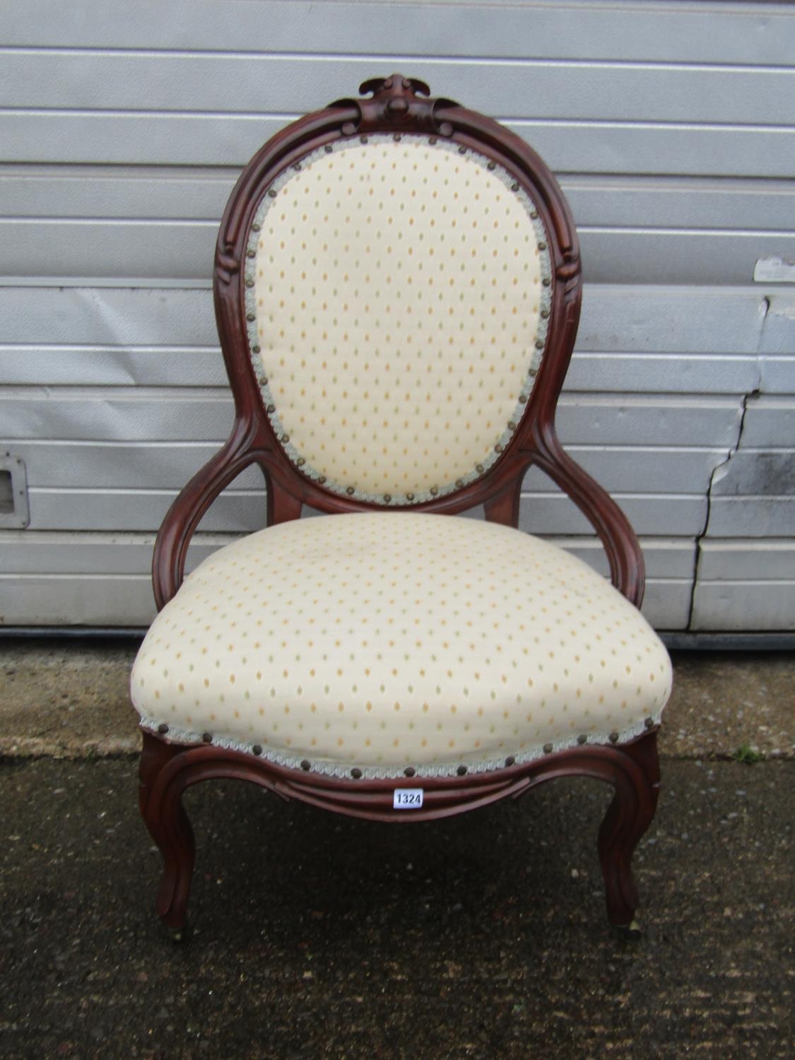A Victorian mahogany spoon back chair with upholstered finish