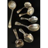 Six 19th century silver caddy spoons and one sugar casting spoon, 2.5oz (7)