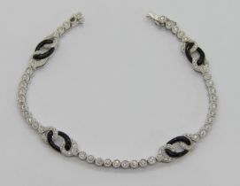 Art Deco style 18ct white gold bracelet millegrain set with diamonds and onyx links, stamped '750