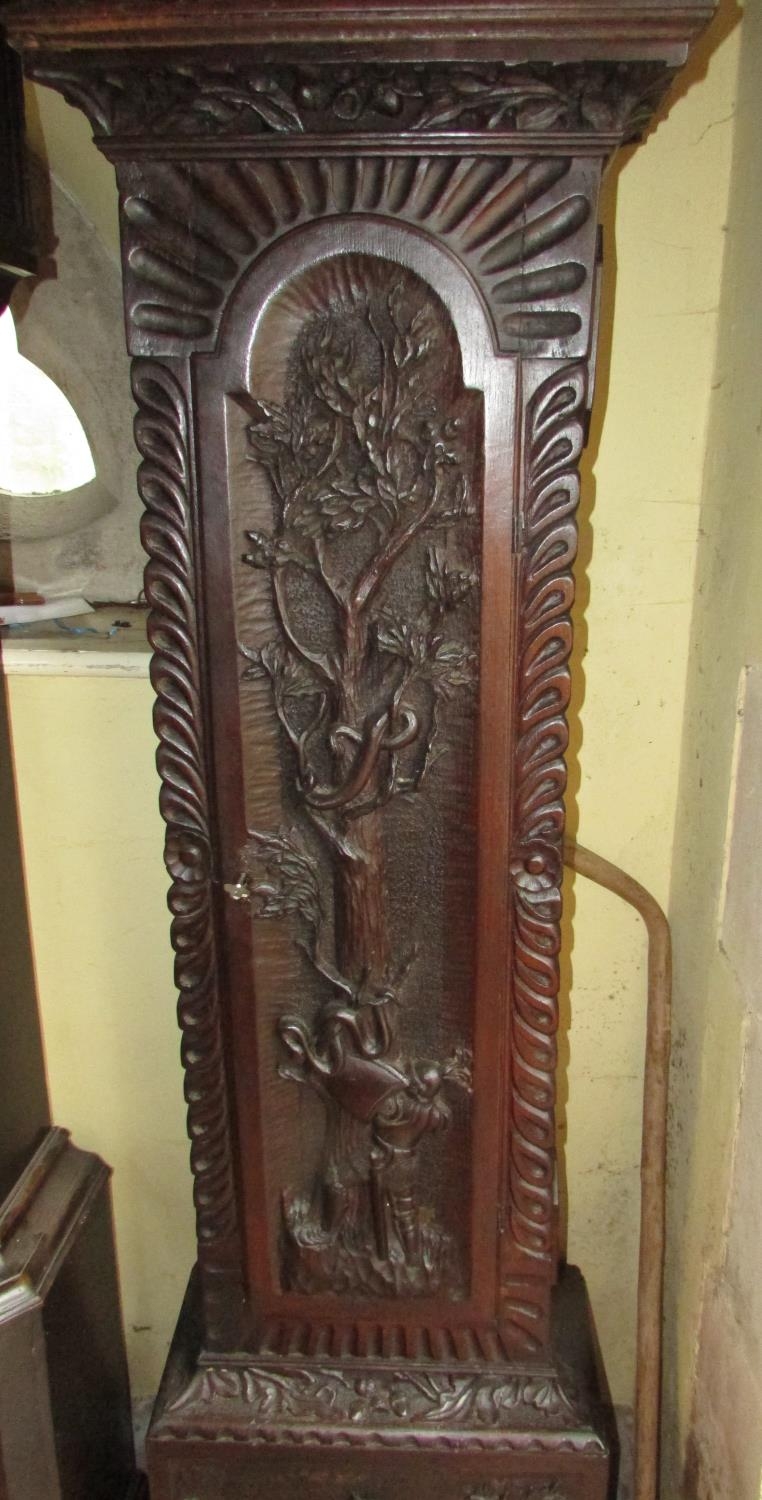 A 19th century oak longcase clock with heavy estate carving, the trunk detailing a knight fighting - Image 9 of 17