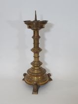 A heavy antique brass ecclesiastical brass pricket candlestick, the pierced castellated phone cradle