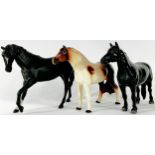 A Beswick black beauty, a fox, a recumbent sow and piglet and two further horses (5)