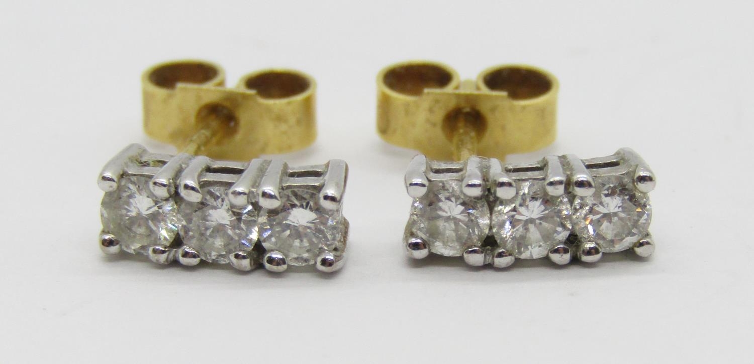 Pair of 18ct three stone diamond stud earrings, each stone 0.10ct approx, maker 'ATLd', London, 1.8g - Image 2 of 3