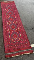 Meshwani Runner with a repeating red and blue diamond pattern with hints of mustard yellow, 236cm
