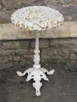 A small 19th century cast iron conservatory table, the circular top with pierced detail, fluted