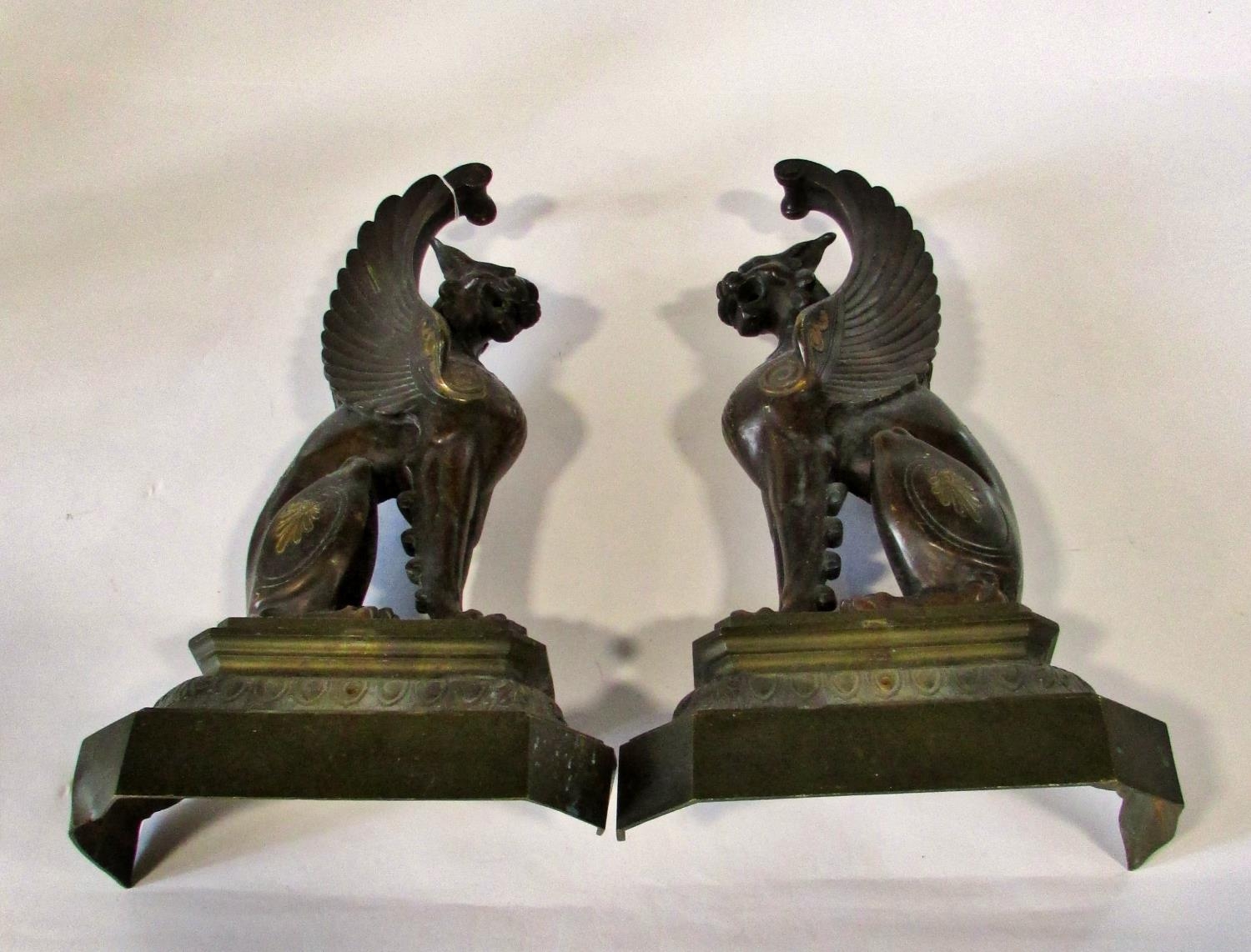 A substantial pair of 19th century cast bronze gryphons, seated in profile, raised on stepped - Image 2 of 6