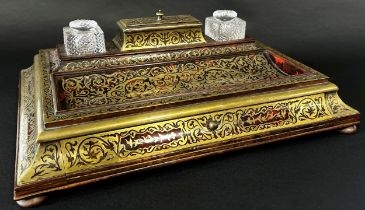 A 19th century boulle work standish with dished tray, segmented box and two cut glass inkwells, over