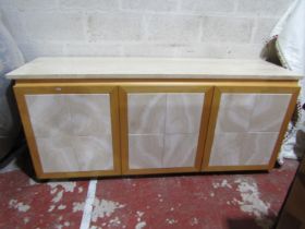 A contemporary side cupboard in beechwood with travertine stone top and door panels, 190cm x 53cm