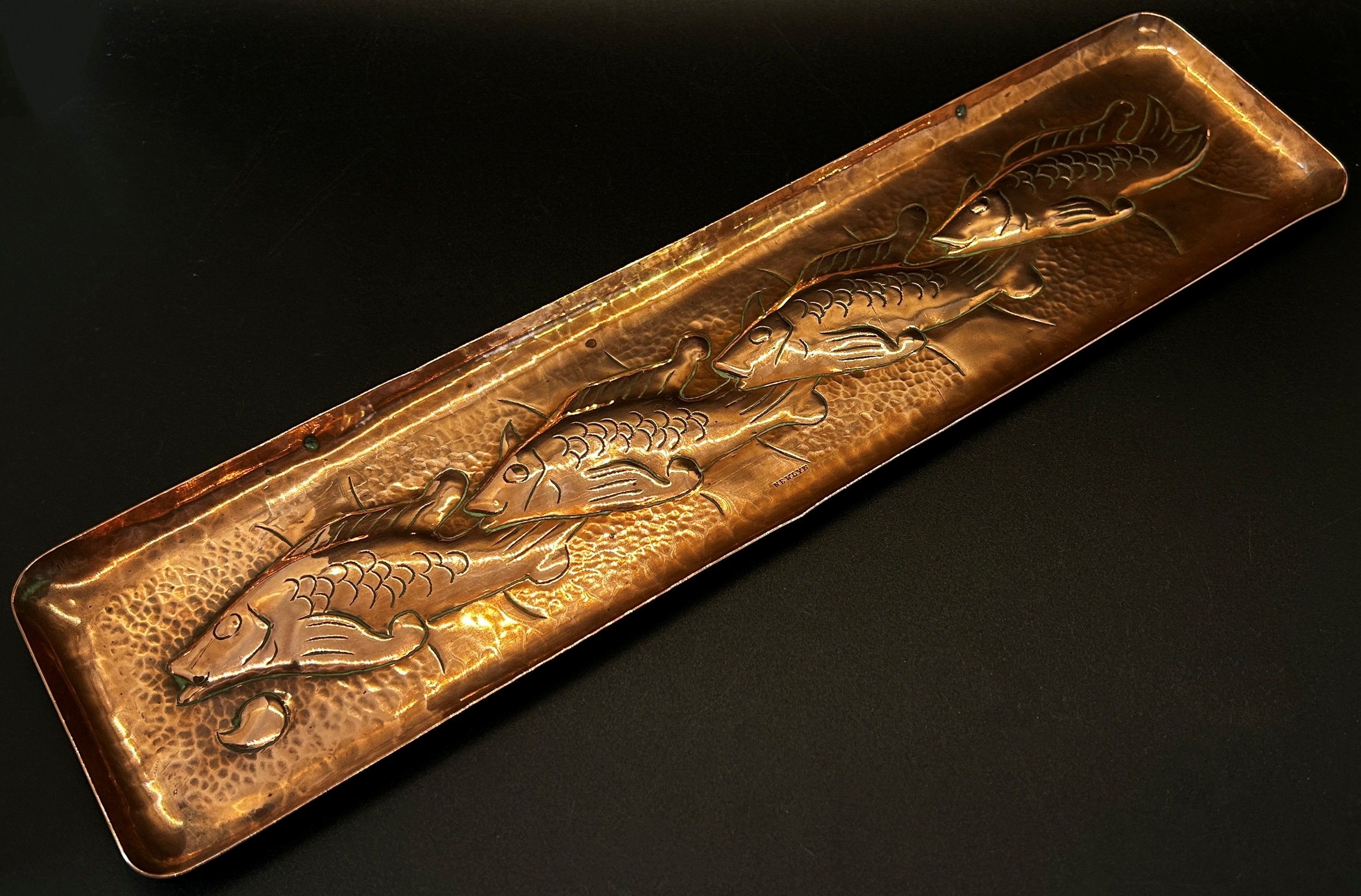 A Newlyn hand worked copper dish with embossed detail showing a trail of fishes, 30cm, stamped - Image 2 of 2