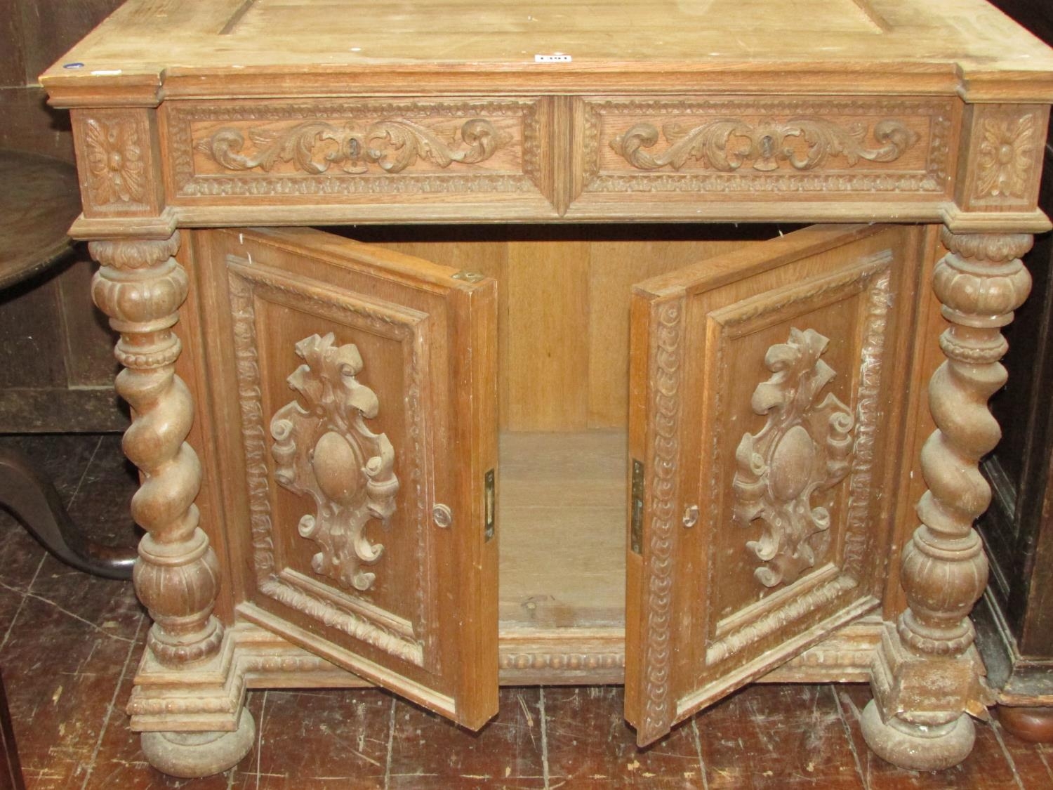 A 19th century oak side cupboard enclosed by two carved and panelled doors with two frieze drawers - Image 4 of 4