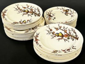 A Victorian dinner service by George Jones & Sons Almonds pattern showing finches amongst