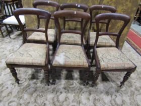 A set of six Victorian mahogany dining chairs on turned legs