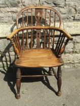 Early 19th century Windsor comb back elbow chair with shaped and pierced splat, principally in ash