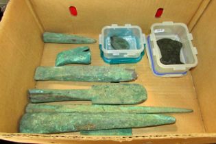 Archaeological interest of an old bronze axe head, a circular clasp and seven further pieces