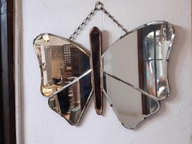 A deco style butterfly mirror