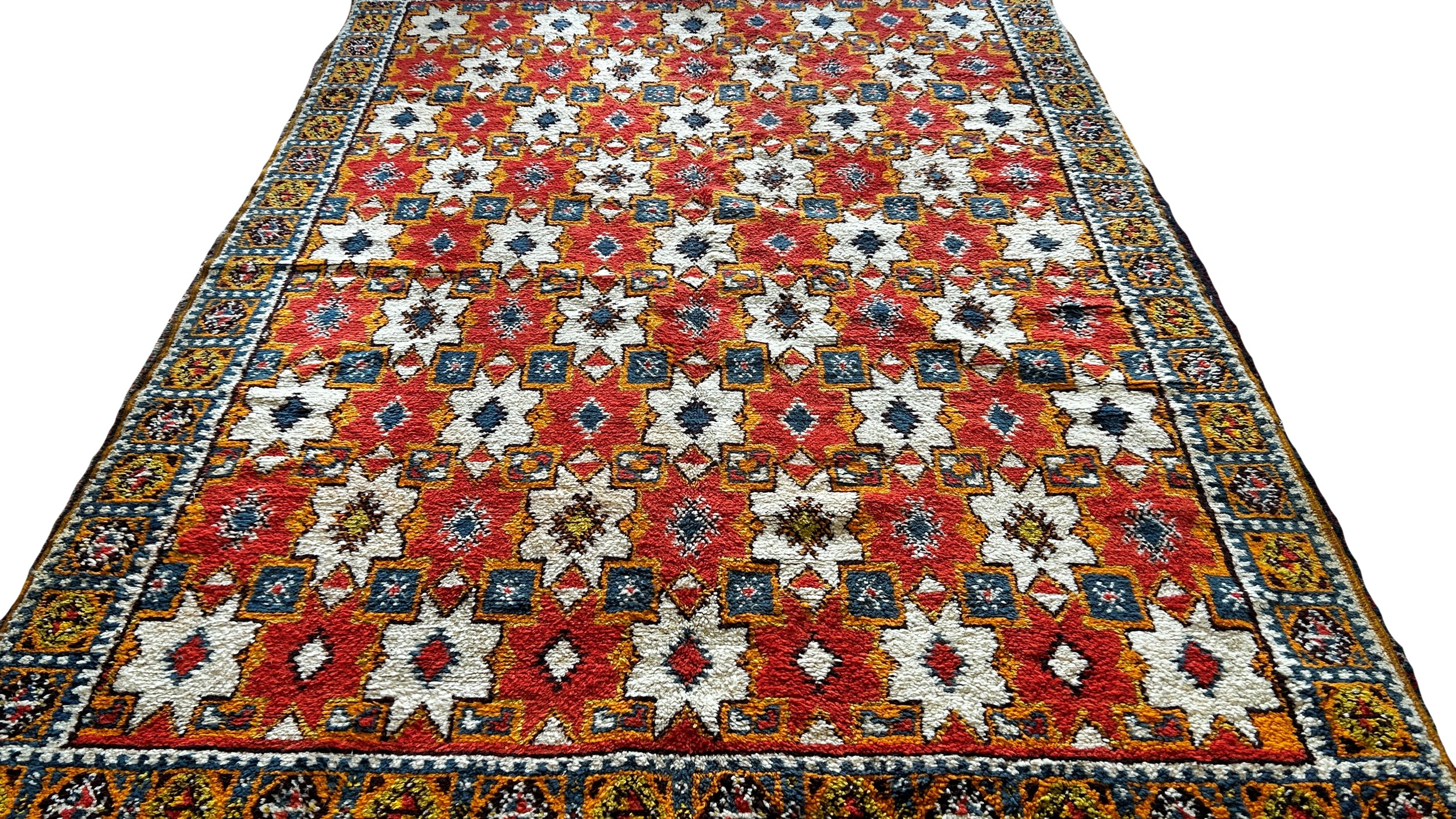 A Moroccan wool carpet with cream stars on a predominantly orange ground, 280 x 190cm approximately. - Image 3 of 3