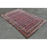 An old Doroskh rug with a tight Paisley design in blue and red tones, 222cm x 140cm