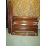 A mahogany sleigh bed frame of usual form to accept a 5ft mattress