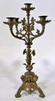 A 19th century continental cast metal five light candelabra, in the gothic style, 49cm high. From