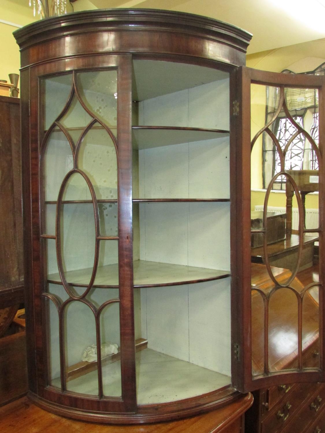 A Regency mahogany bow fronted hanging corner cupboard with astragal glazed panelled doors, original - Image 3 of 3