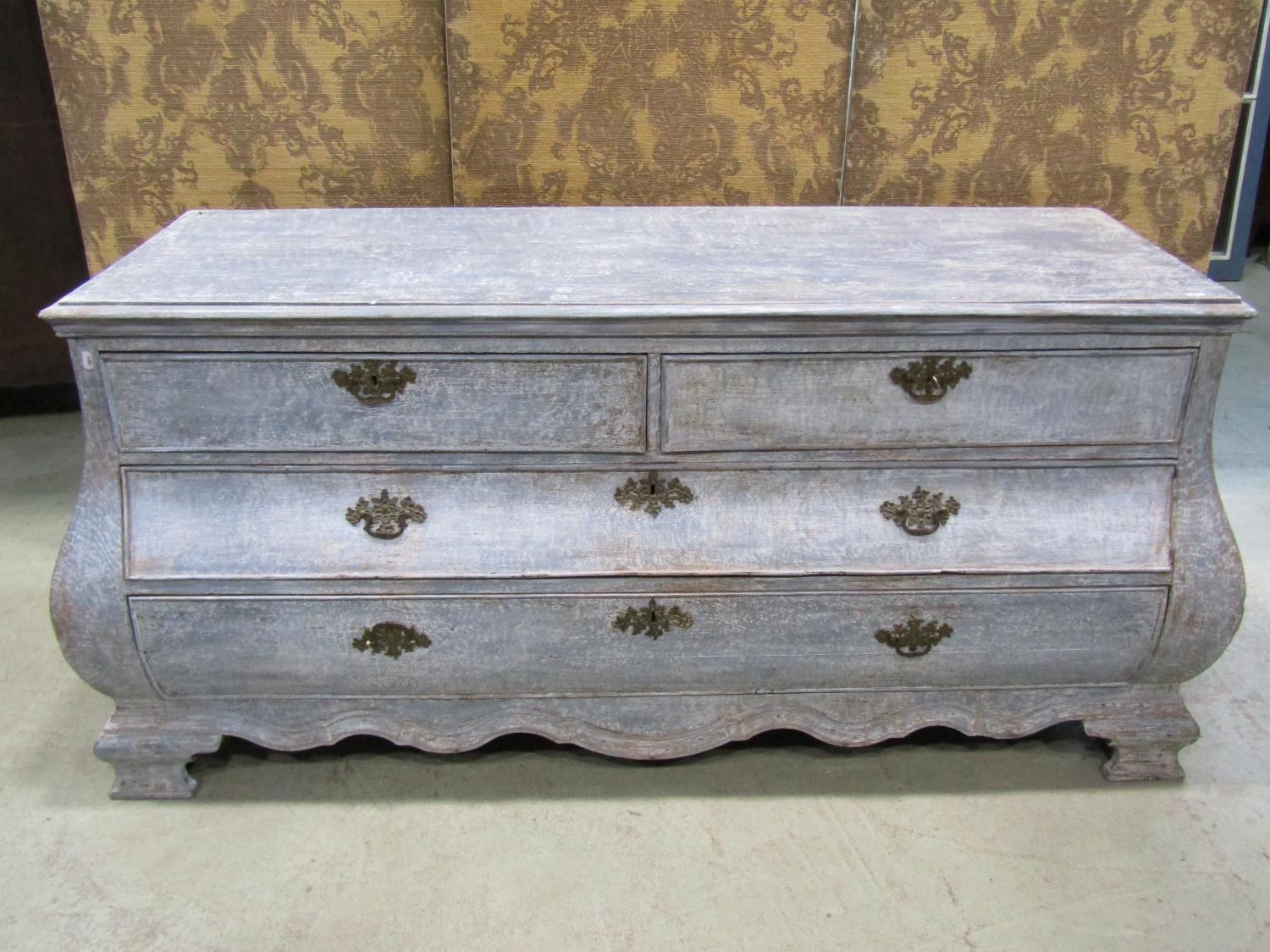 A large old Dutch Dry-scaped bombe commode chest, with two short and two long drawers, 175cm long
