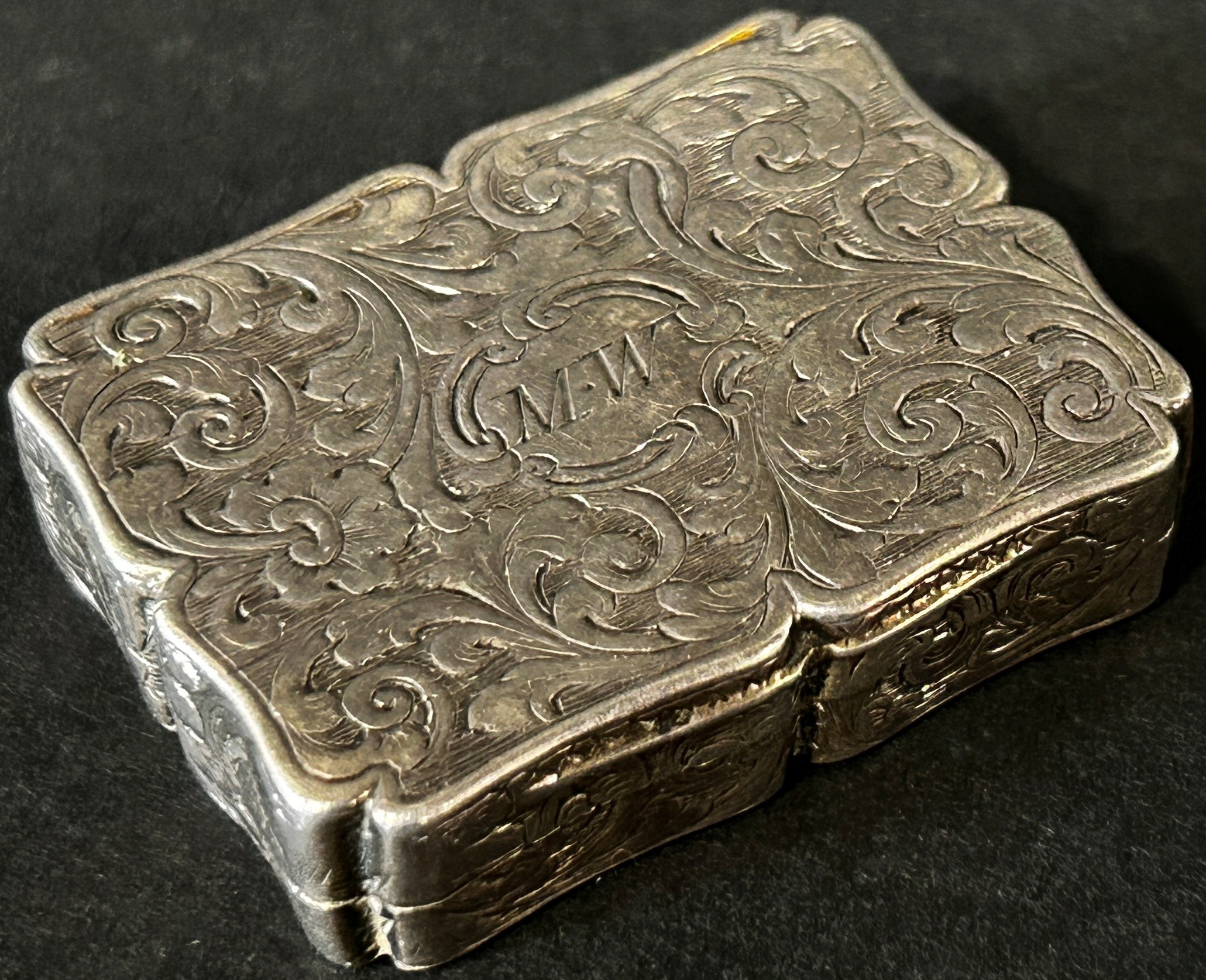 A Victorian silver vinaigrette with gilded floral grill, Birmingham date mark rubbed, maker Joseph