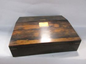 A 19th century coromandel writing slope with a worn interior, 30cm wide.