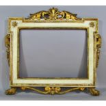 A 19th century continental carved and painted wooden frame, with pierced scrolling surmount, and