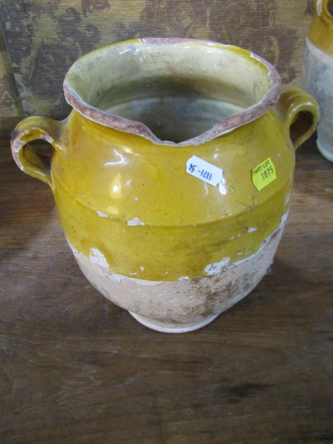 Three rustic terracotta pots with loop handles, partially glazed and a further terracotta ewer - Image 2 of 4