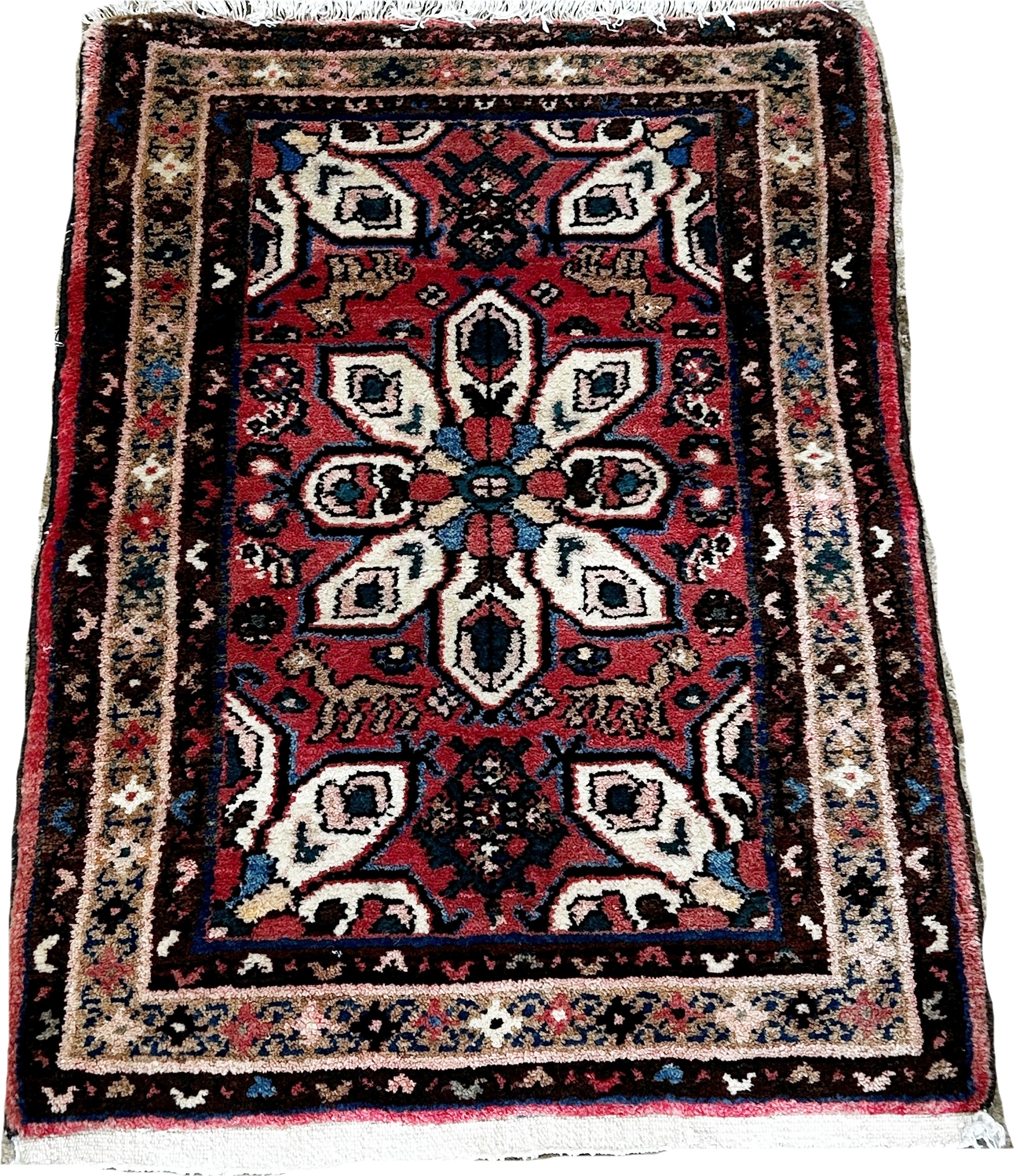 A small Iranian Hosseinabad rug with a central petal medallion 90cm x 63cm approximately