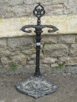 A decorative iron stick stand in the Victorian style