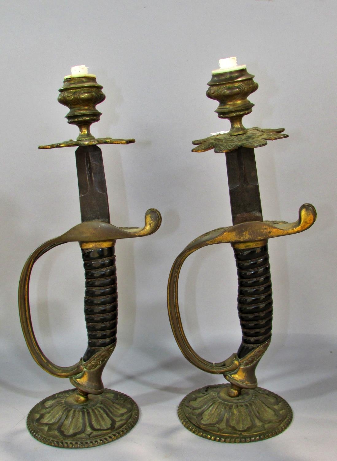 A pair of 19th century sword hilt candlesticks conversions 28cm tall.