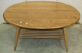 An Ercol occasional table principally in elm, the oval top 100cm max