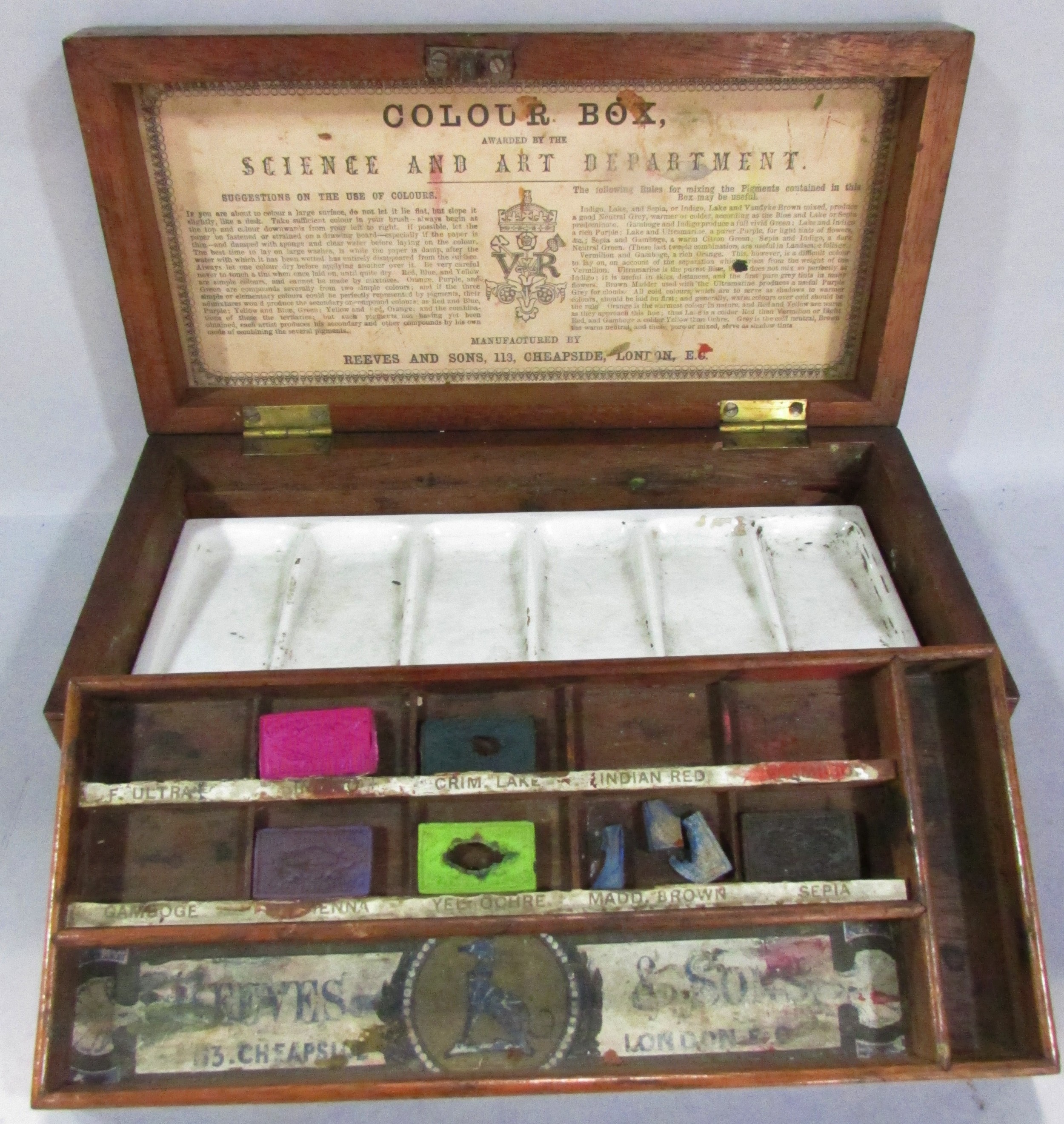 A Victorian Reeves & Sons mahogany Colour Box with some original water colour tablets and ceramic