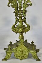 A pair of 19th century continental gilt-brass five light candelabras with scrolling acanthus