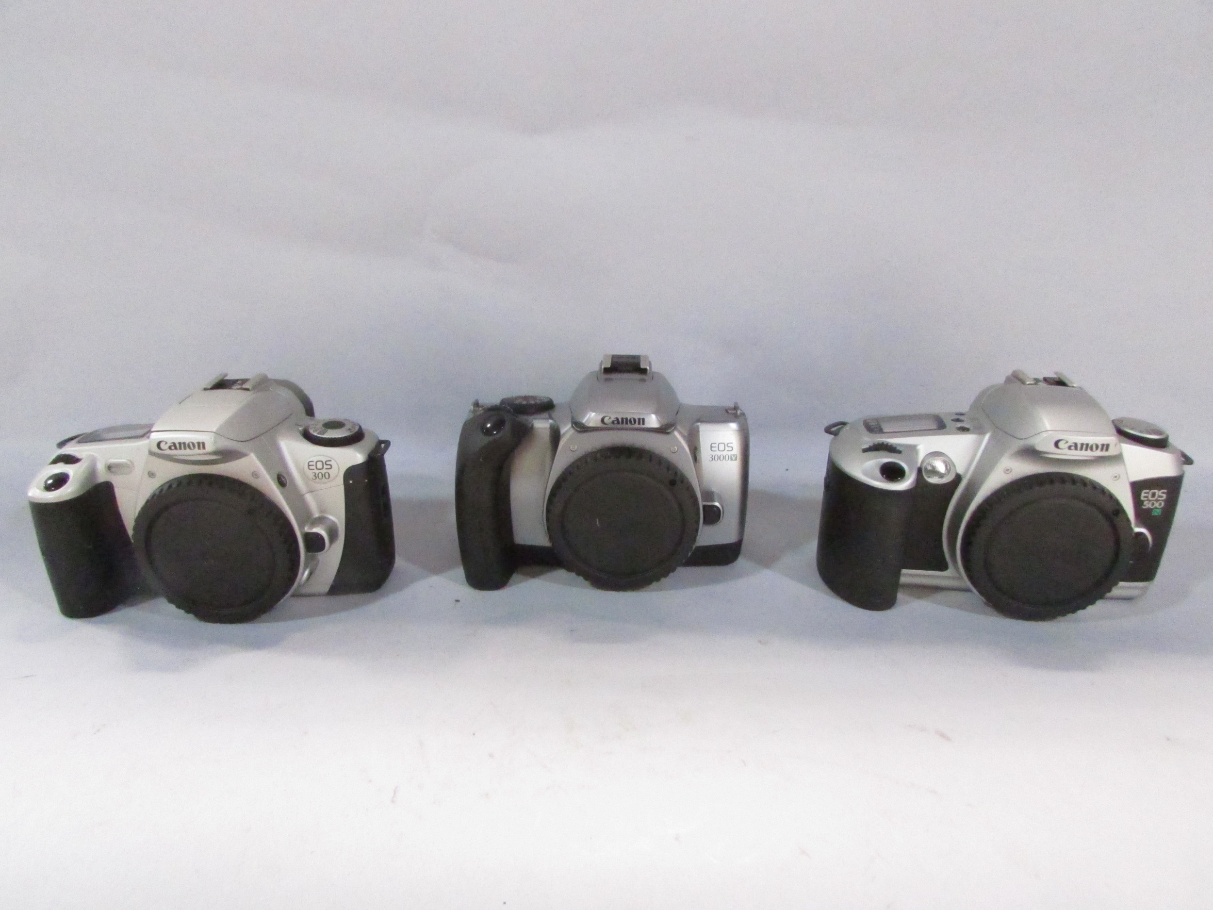 Nine Canon cameras models: EOS 80, EOS 1000F, EOS 3000V, EOS 500 N, EOS, RO AF35M, EOS 300 with - Image 3 of 12