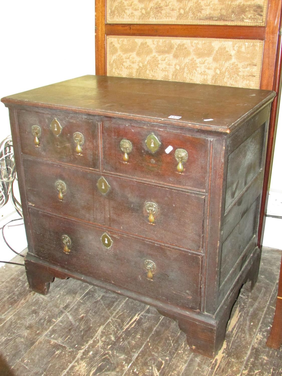 A small 18th century oak chest of two long and two drawers raised on bracket supports with pear drop - Image 2 of 4