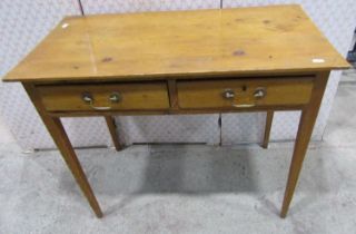 A stripped pine side table with two frieze drawers on square taper legs, 83cm wide