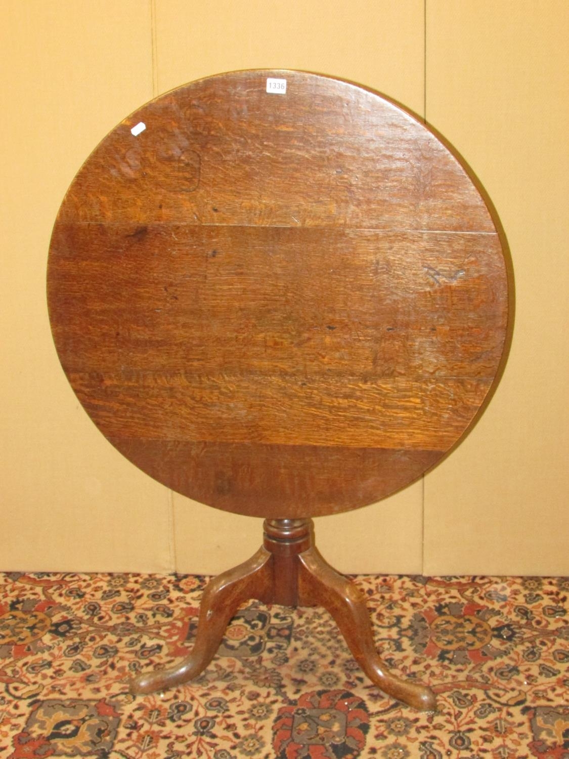 A Georgian oak tripod table, 80cm diameter top