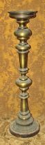 A large floor-standing brass ecclesiastical pricket type candlestick, 109cm high From the private