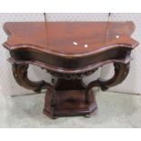 A mahogany console table on shaped supports, 93cm wide