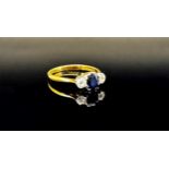 Early 20th century 18ct sapphire and diamond three stone ring with platinum setting, size N, 2.3g