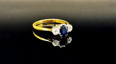 Early 20th century 18ct sapphire and diamond three stone ring with platinum setting, size N, 2.3g