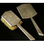 An art deco dressing table hand mirror and hair brush, Sheffield 1937, 1938 respectively, maker